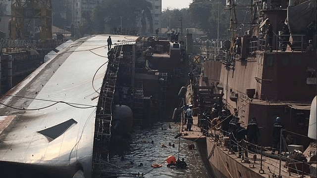 Two sailors were killed and 14 others were injured as INS Betwa, a guided missile frigate, tipped over during undocking at the Naval Dockyard in Mumbai on 5 December. (Photo Courtesy: Twitter/<a href="https://twitter.com/AskAnshul">‏@<b>AskAnshul</b></a>)
