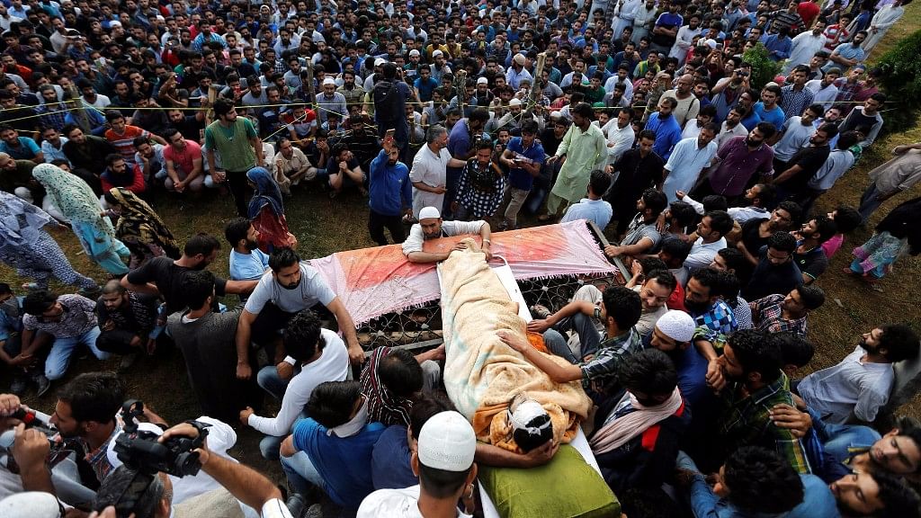 People in Kashmir attend  the funeral of Harkat-ul-Mujahideen commander Burhan Wani. (Photo: Reuters)