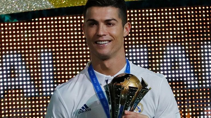 Real Madrid’s Cristiano Ronaldo holds the FIFA Club World Cup trophy. (Photo: AP)&nbsp;