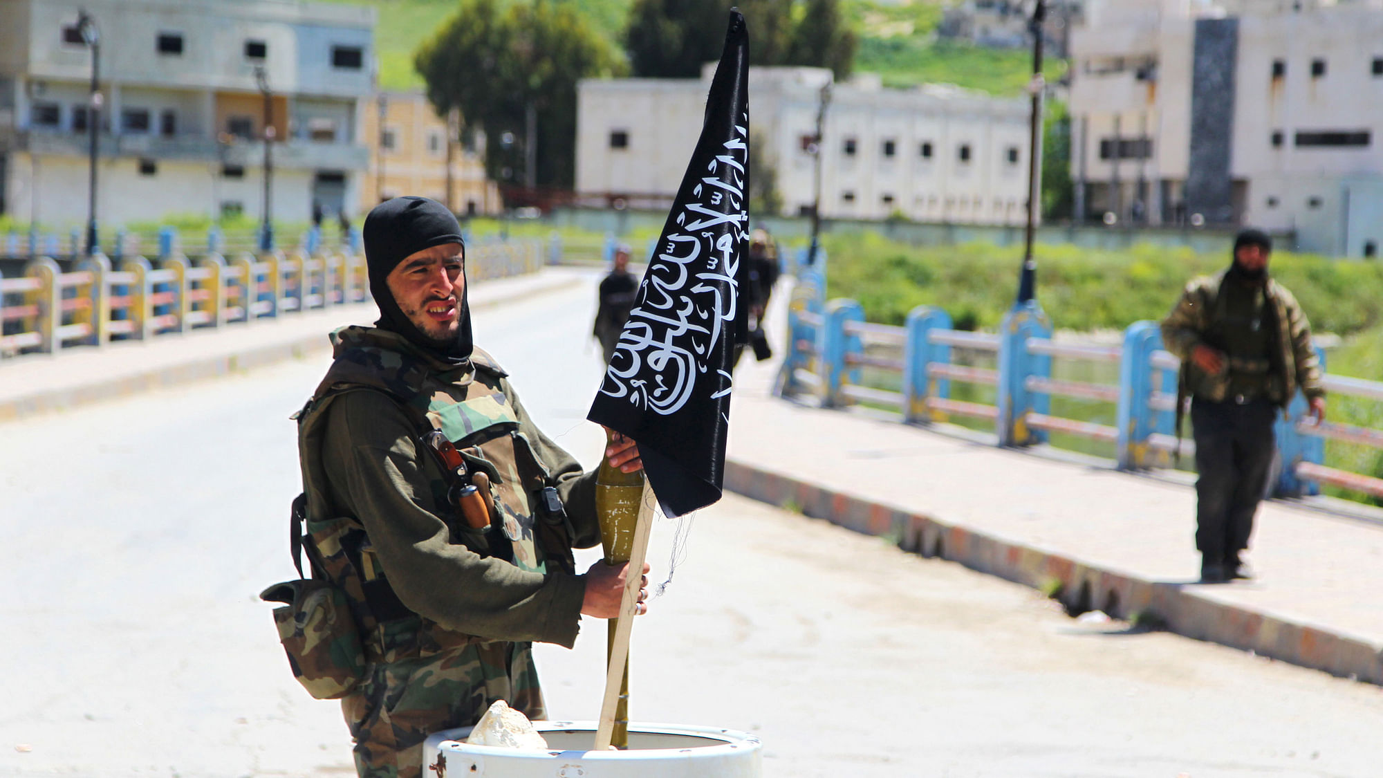 A Nusra Front Fighter with a Nusra Front flag in Syria. (Photo: Reuters)
