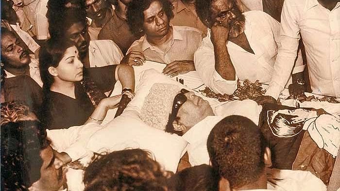 In 1984, MGR was paralysed due to a stroke, which is when Jayalalithaa attempted to take over the party.  (Photo Courtesy: <a href="http://indianhistorypix.blogspot.in/2014/03/j-jayalalitha-during-funeral-of-m-g.html">Indian History Pics blog spot</a>)