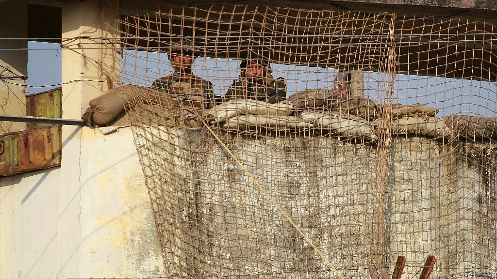 Soldiers stand guard at the army base in Nagrota, Jammu, on 30 November 2016. (Photo: AP)