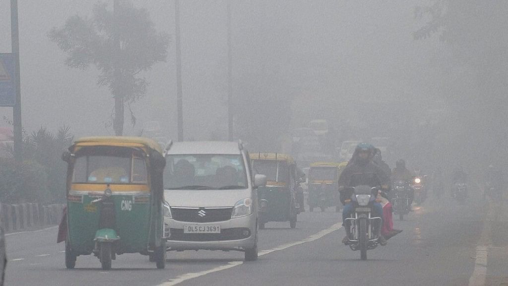 Representative image. Vehicles move through dense fog in New Delhi on Wednesday. (Photo Courtesy: PTI)