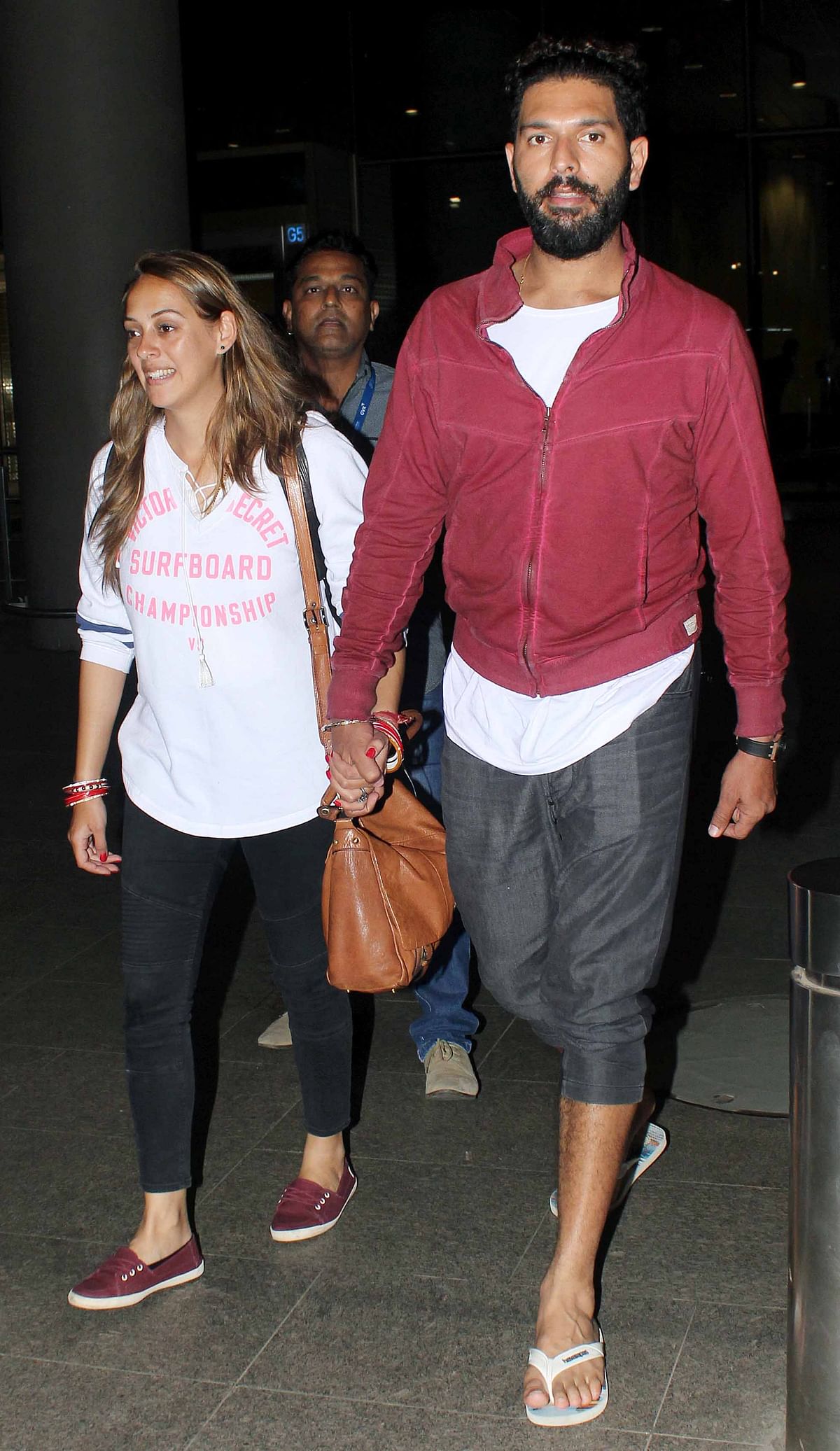 Pictures of Yuvraj Singh and Hazel Keech returning from their ‘secret’ honeymoon.