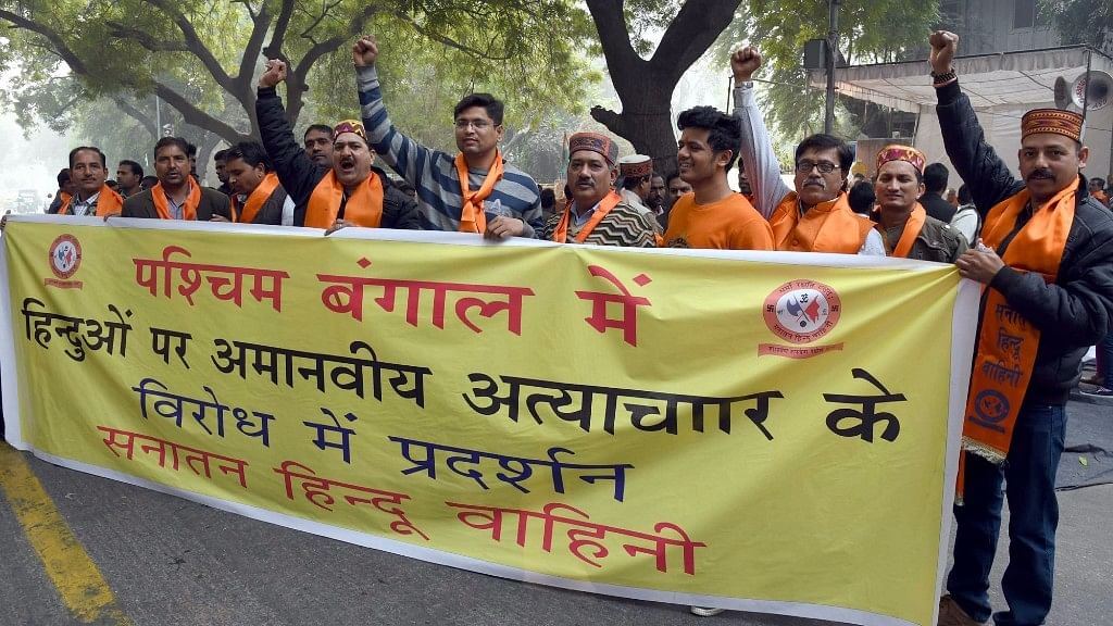 Right wing activists stage a demonstration against Dhulagarh violence in New Delhi. (Photo: IANS)