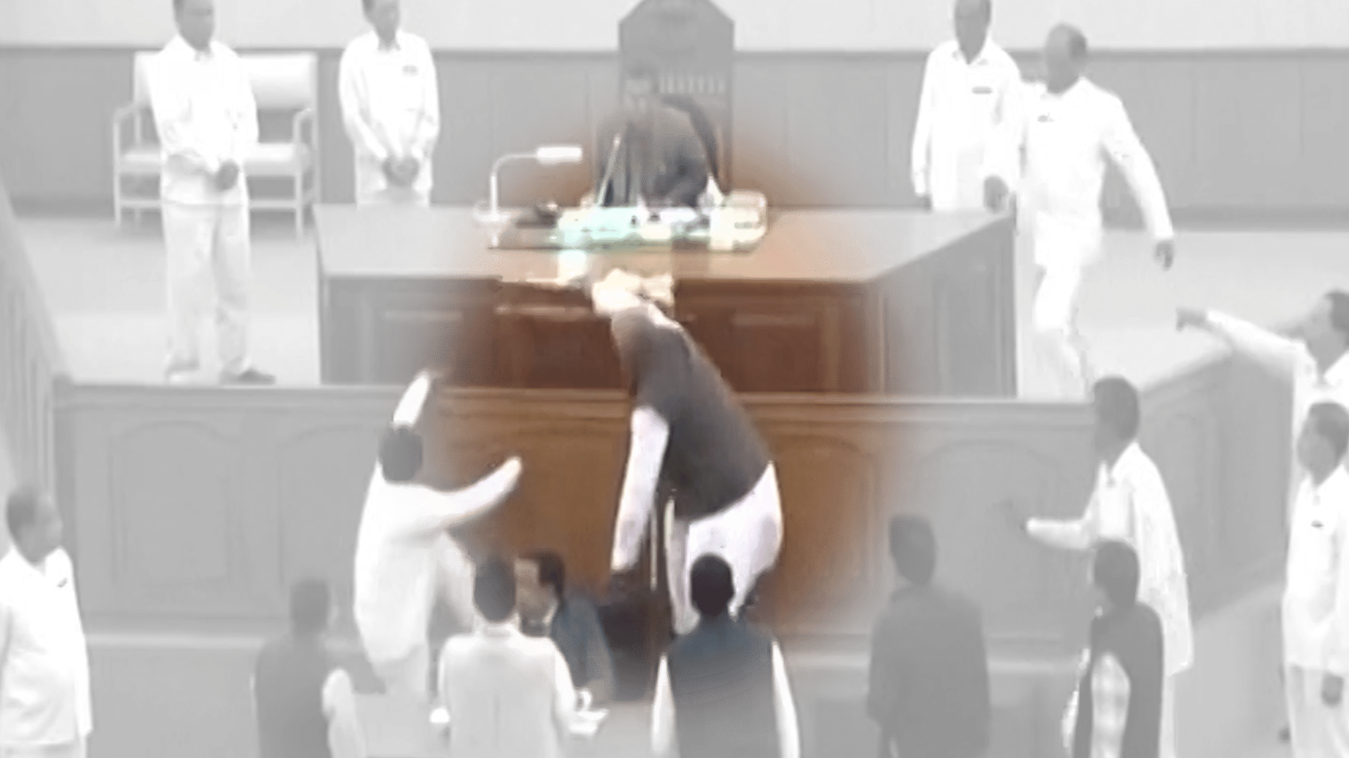 TMC MLA ran away with the Speaker’s mace. (Photo: ANI screengrab/altered by <b>The Quint</b>)