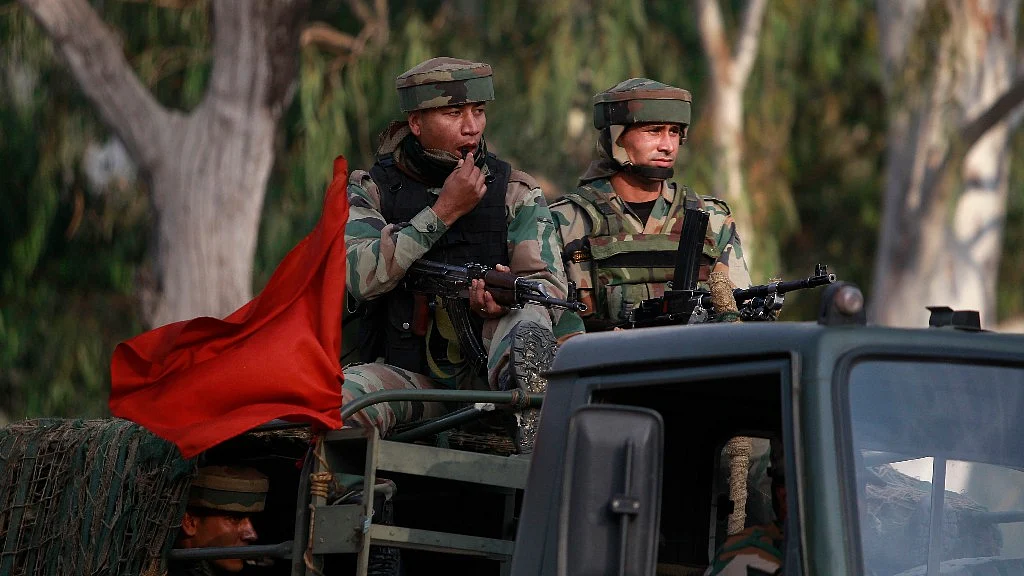 Soldiers patrol a road near the site of the terror attack in Nagrota, Jammu, on 29 November 2016. (Photo: AP)