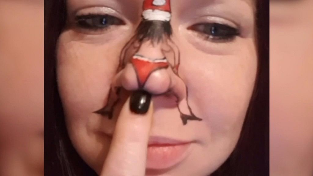 Draw a girl’s figure on your nose with Santa’s cap and bare essential clothing. Turn on some Christmas music &amp; watch this video for directions. (Photo: AP screengrab)