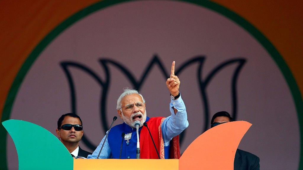 Prime Minister Narendra Modi addresses a campaign rally ahead of state assembly elections, at Ramlila ground in New Delhi on 10 January 2015. (Photo: Reuters)