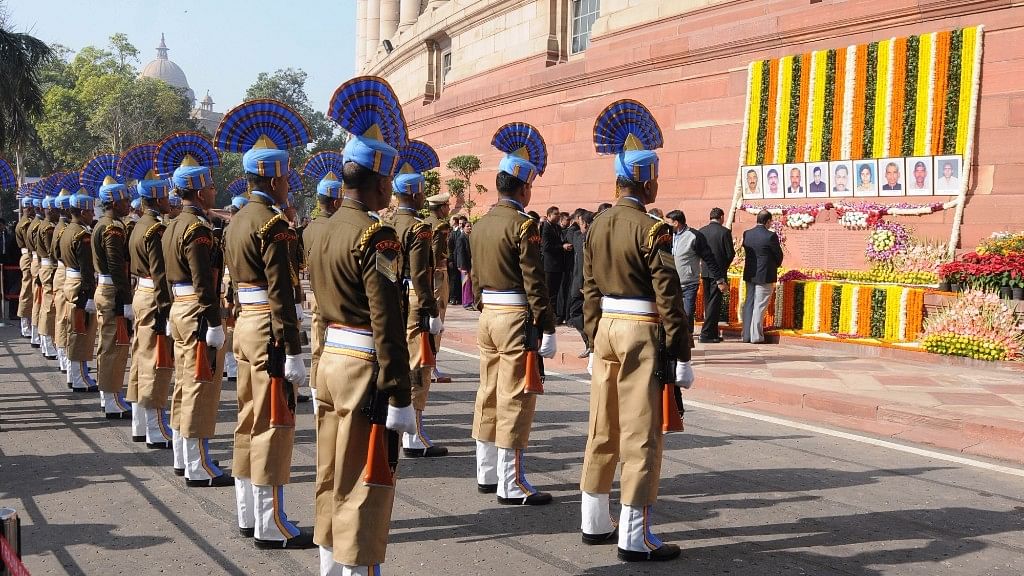 Security personnel pay homage to the martyrs of the 2001 Parliament attack, at Parliament building.