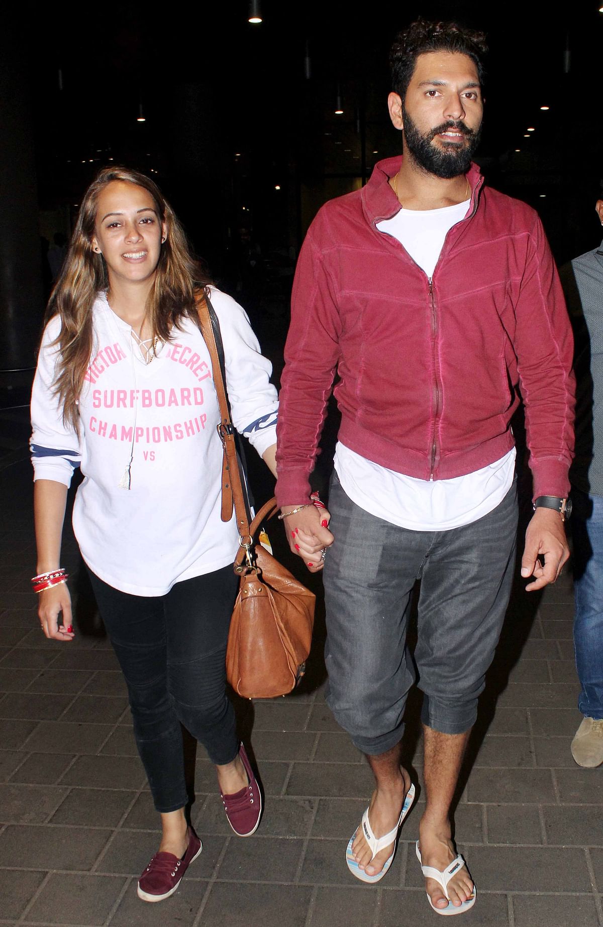 Pictures of Yuvraj Singh and Hazel Keech returning from their ‘secret’ honeymoon.