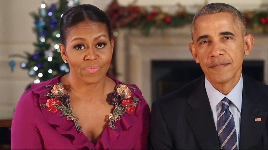 Former First Lady Michelle Obama (L) and former US President Barack Obama.