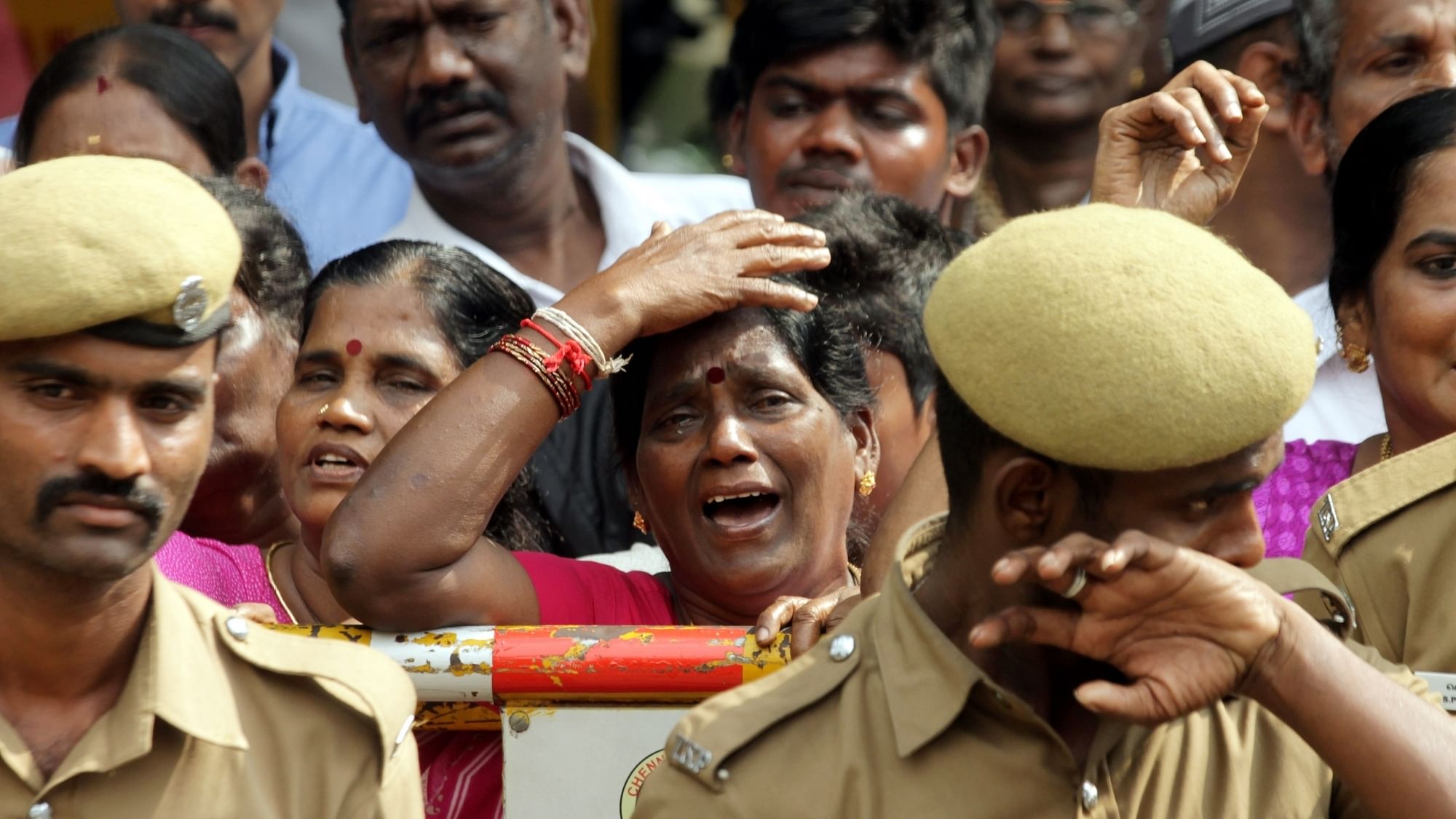 Jayalalithaa’s supporters mourning her demise in Chennai on Tuesday. (Photo: IANS)