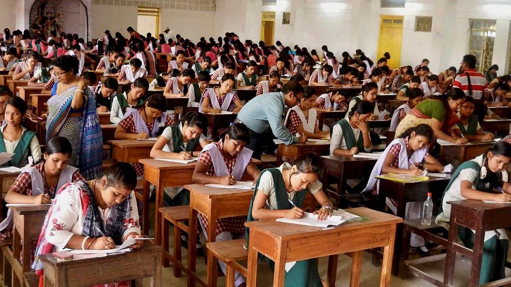 File photo of tudents appearing for class 12 board exams in a school, at Agartala. (Photo: PTI)