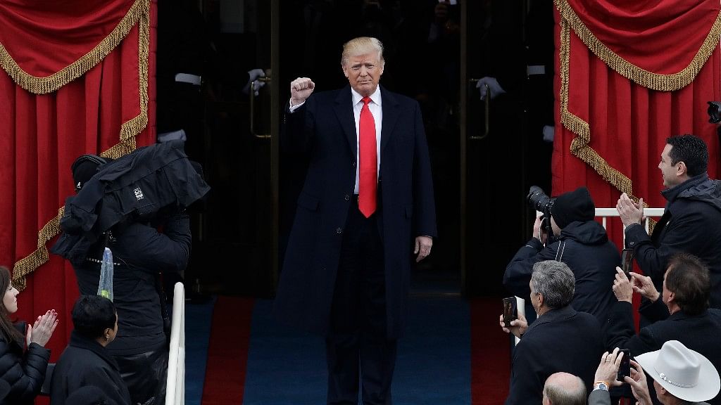 President-elect Donald Trump pumps his fist as he arrives for his Presidential Inauguration at the US Capitol on 20 January 2017. (Photo: AP)