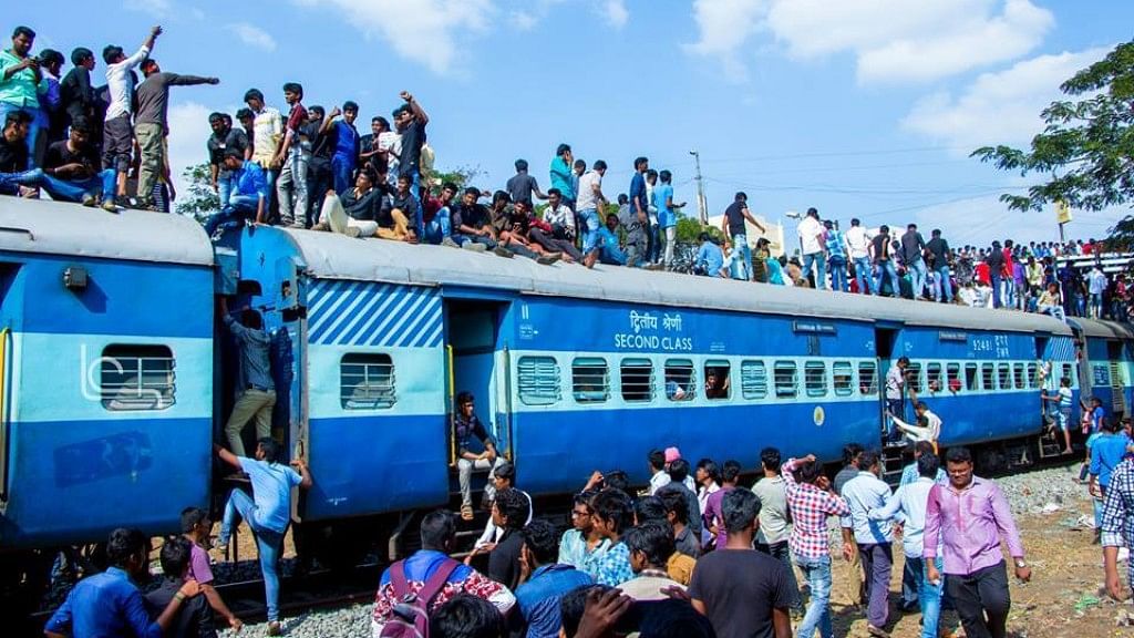 Protesters climb a train during the Rail Roko demonstration in Salem. (Photo Courtesy: Facebook/<a href="https://www.facebook.com/piyush.manush">@Piyush Manush</a>)
