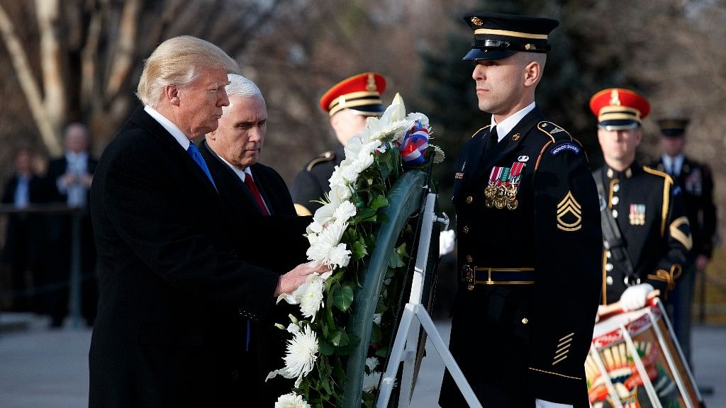 President-elect Donald Trump, accompanied by Vice President-elect Mike Pence places a wreath at the Tomb of the Unknowns. (Photo: AP)