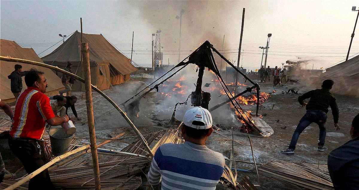 Locals and fire brigade personnel dousing the fire after a police tent caught fire in Sagar Island during the ongoing Ganga Sagar mela on Saturday. Photo used for representational purpose. (Photo: PTI)