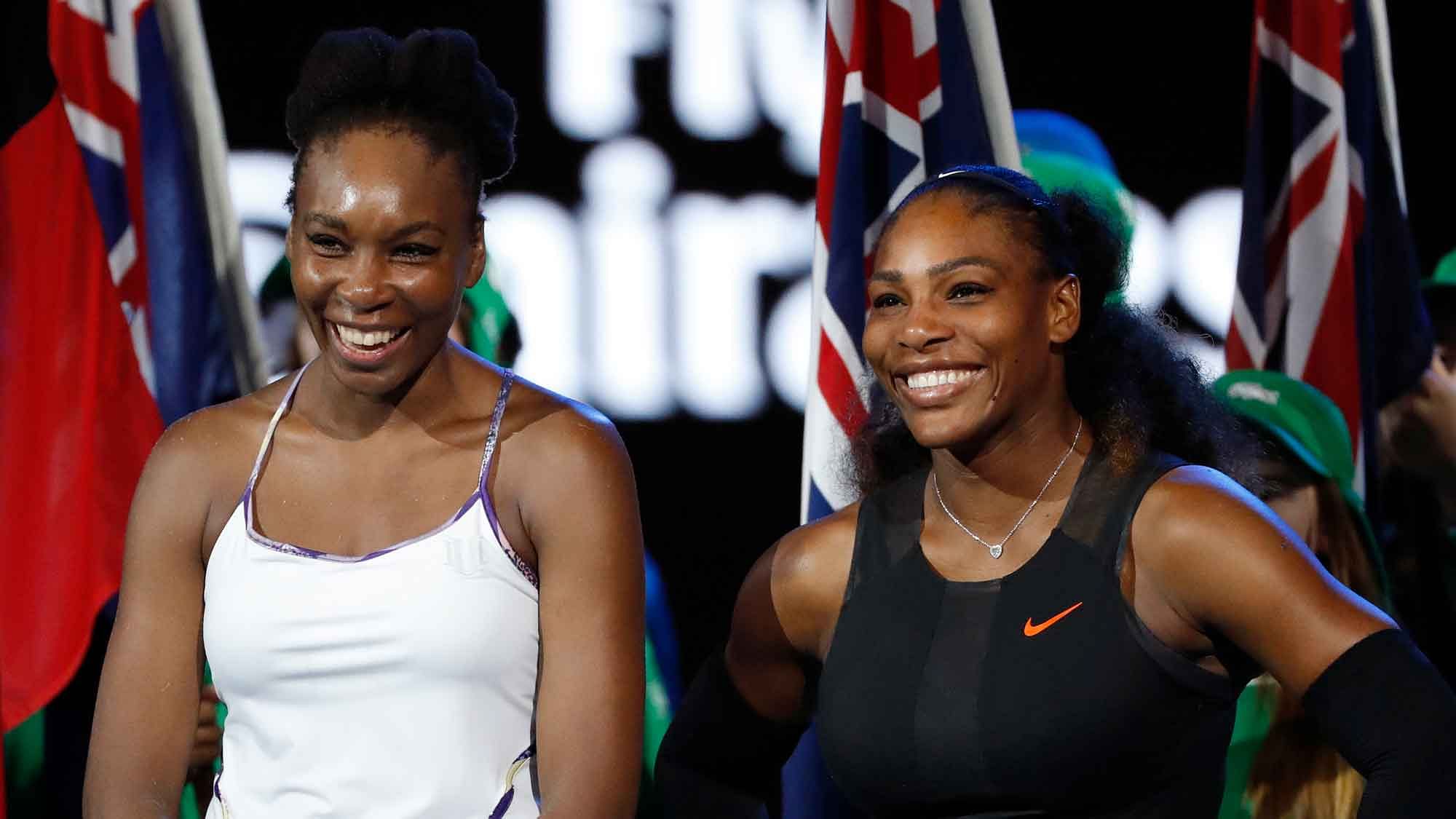 United States’ Serena Williams, right, and her sister Venus smile after Serena won their women’s singles final at the Australian Open. (Photo: AP)