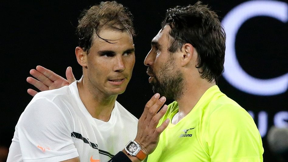 Rafael Nadal (L) and Marcos Baghdatis (R). (Photo: AP)