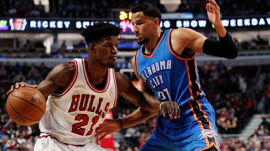 Chicago Bulls forward Jimmy Butler (21) is defended by Oklahoma City Thunder forward Andre Roberson (21) during the first half of the game at United Center on Monday. (Photo: Reuters)