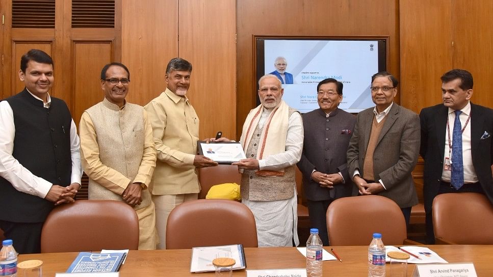 

The Committee of Chief Ministers on digital payment led by Andhra Pradesh CM Chandrababu Naidu presents Interim Report to the PM Modi. (Photo: IANS)
