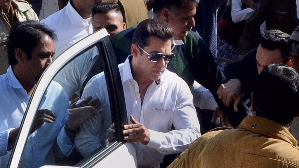 Actor Salman Khan, walks through a crowd outside the court, has been acquitted in 1998 Arms Act case by Jodhpur court, in Jodhpur on Wednesday. (Photo Courtesy: PTI)