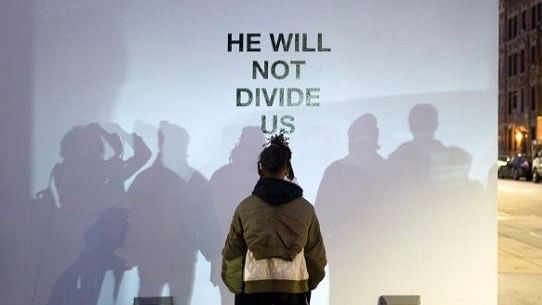 The ‘He Will Not Divide Us’ live stream will continue for 4 years or the duration of Trump’s presidency. (Photo Courtesy: Twitter/<a href="https://twitter.com/thecampaignbook">@thecampaignbook</a>)