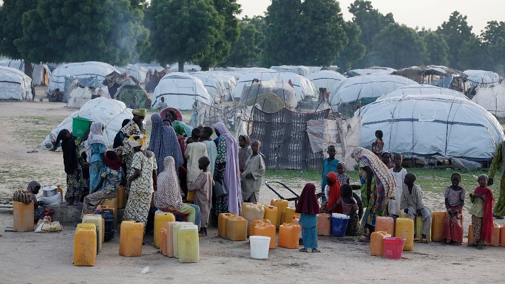 File photo: People displaced by Islamist extremists fetch water at the Muna camp in Maiduguri, Nigeria. (Photo: AP)