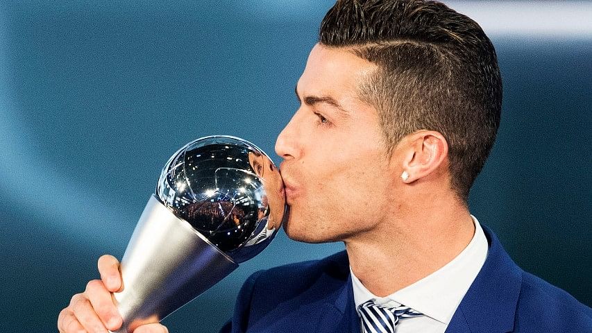Cristiano Ronaldo kisses the trophy after winning The Best FIFA Men’s Player award during the The Best FIFA Football Awards 2016 ceremony held at the Swiss TV studio in Zurich, Switzerland. (Photo: AP)