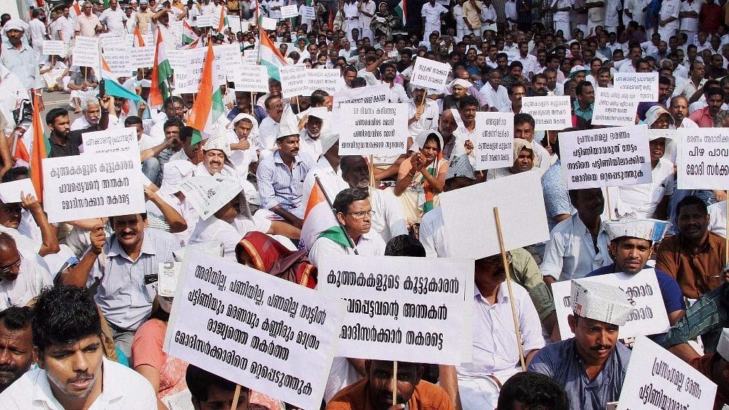 Congress workers gather outside head post office picketing to protest against demonetisation in Kozhikode on Friday. (Photo: PTI)