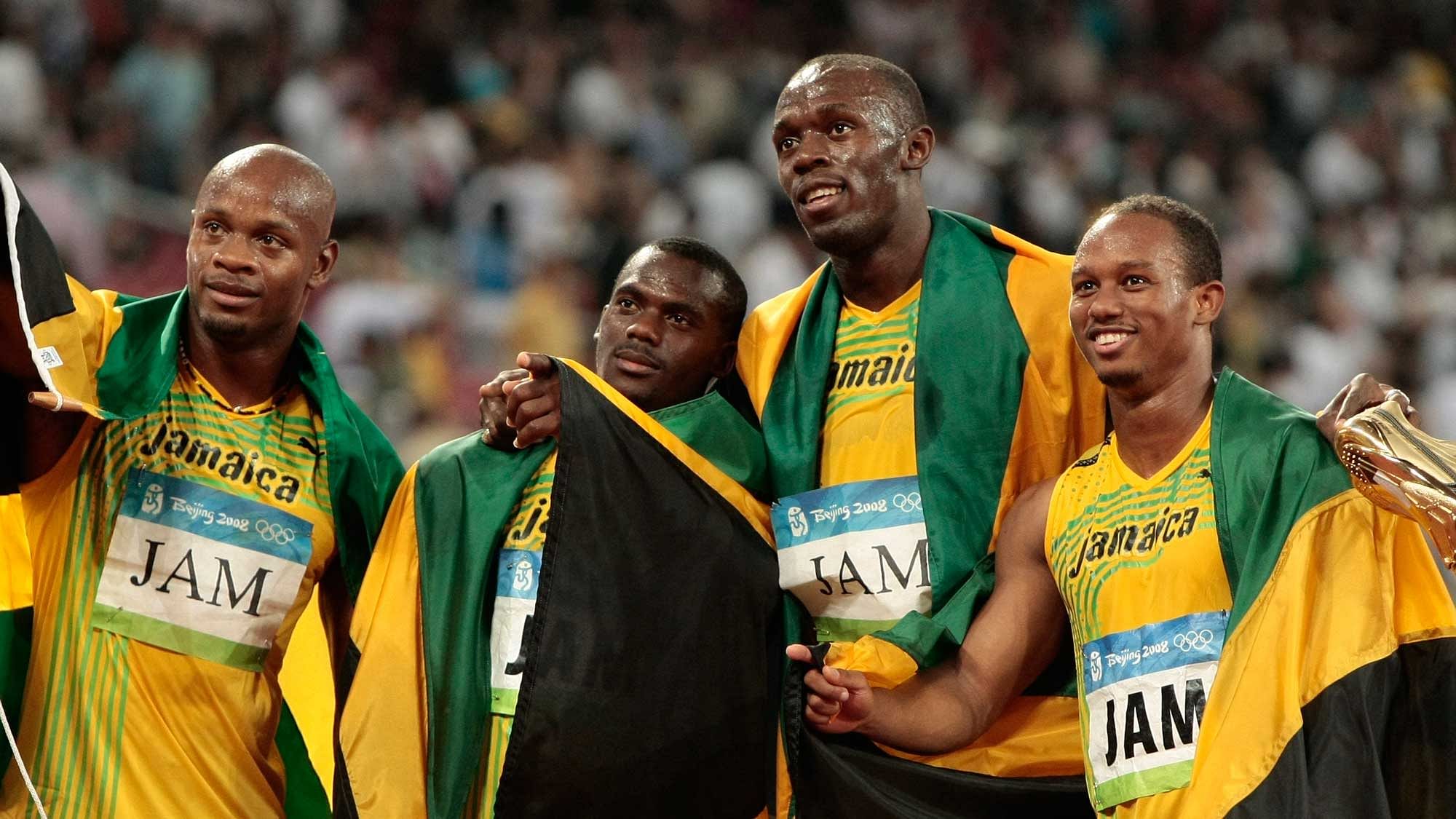 In this Friday, Aug. 22, 2008 file photo, Jamaica’s gold medal winning relay team, Usain Bolt, 2nd right, Michael Frater, right, Asafa Powell, left, and Nesta Carter celebrate after the men’s 4x100-meter relay final at the Beijing 2008 Olympics. (Photo: AP)