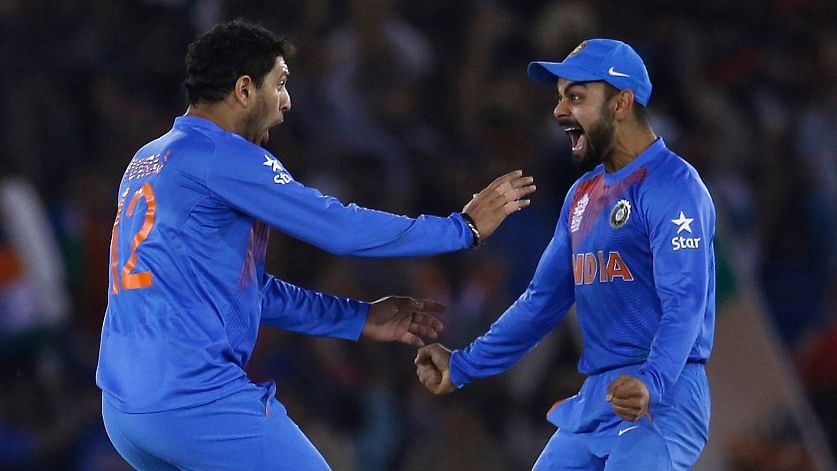  India’s Yuvraj Singh (L) celebrates with his teammate Virat Kohli after taking the wicket of Australia’s captain Steven Smith in a T20 match in 2016. (Photo: Reuters)