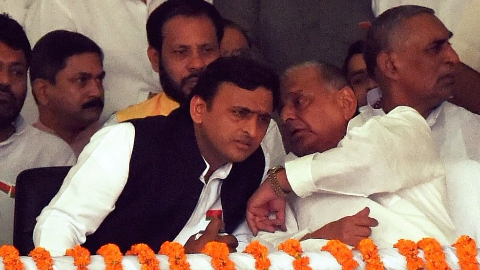 Uttar Pradesh Chief Minister Akhilesh Yadav and Samajwadi Party chief Mulayam Singh Yadav. (Photo: IANS)