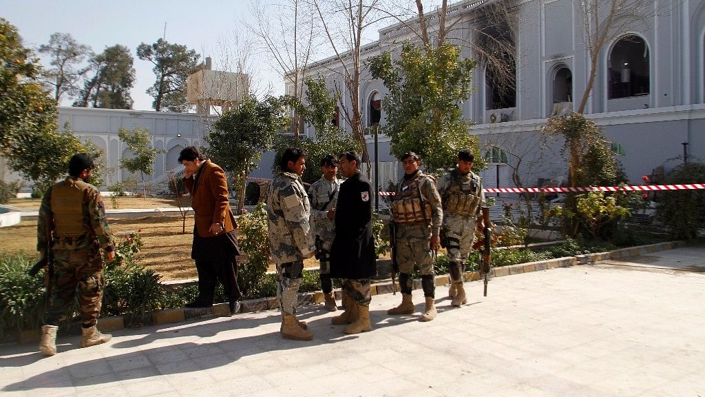 Afghan security forces are seen in front of Kandahar guesthouse after a bomb blast in Kandahar, Afghanistan. (Photo: AP)