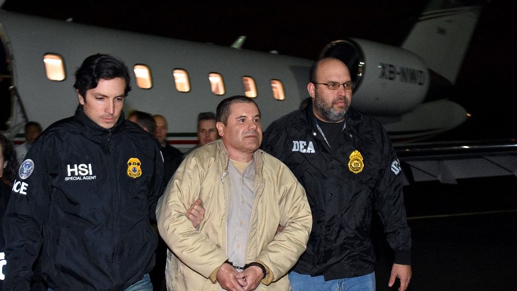 In this photo provided by the US law enforcement, authorities escort Joaquin “El Chapo” Guzman, centre, at Long Island MacArthur Airport on Thursday. (Photo: AP)