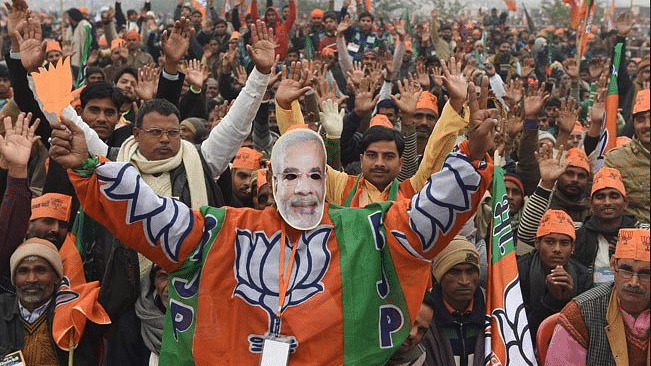

The crowd cheers for Prime Minister Narendra Modi (not in photograph) at an election rally in Lucknow, Uttar Pradesh, ahead of the upcoming elections to the state’s legislature. (Photo Courtesy: Twitter/<a href="https://twitter.com/ashish40411">@ashish40411</a>)