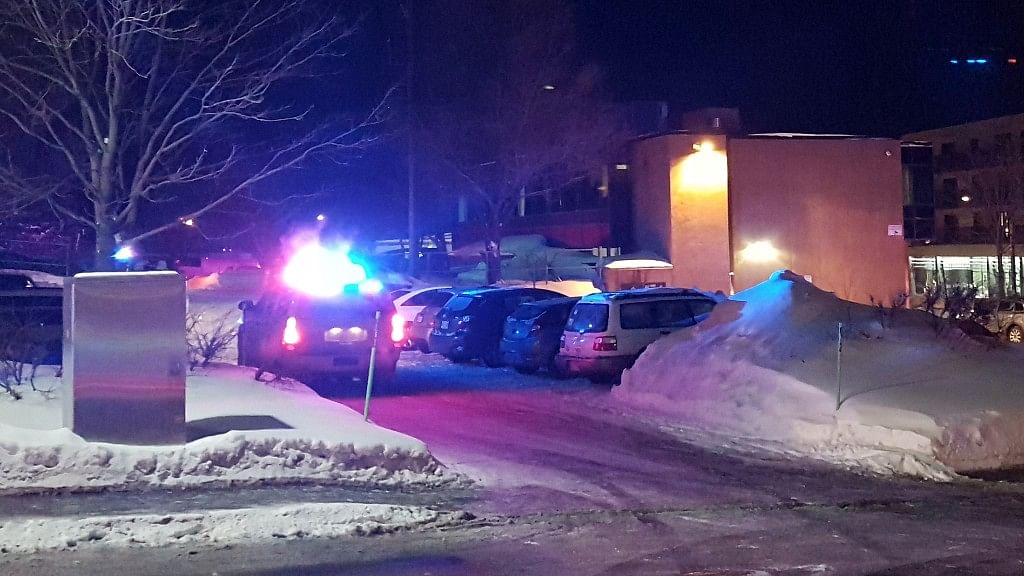 Police arrive at the scene of a fatal shooting at the Quebec Islamic Cultural Centre in Quebec City, Canada. (Photo: Reuters/Mathieu Belanger)