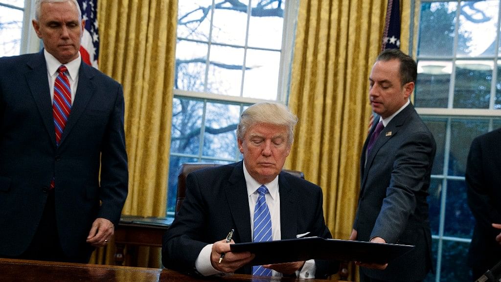 Vice President Mike Pence (left), President Donald Trump and White House Chief of Staff Reince Priebus (right) in the Oval Office of the White House. (Photo: AP)