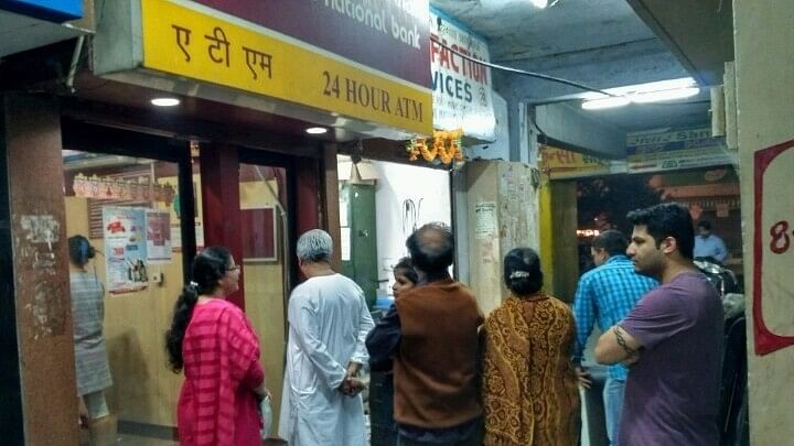 People wait  outside ATM kiosks after Prime Minister Narendra Modi announced demonetisation  on  8 November 2016. (Photo: IANS)