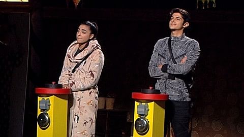 Bani J and Rohan Mehra stand for the mid-week eviction. (Photo Courtesy: Colors)
