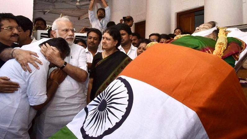 Prime Minister Narendra Modi comforts Panneerselvam after Jayalalithaa’s demise as Sasikala watches. (Photo: PTI)