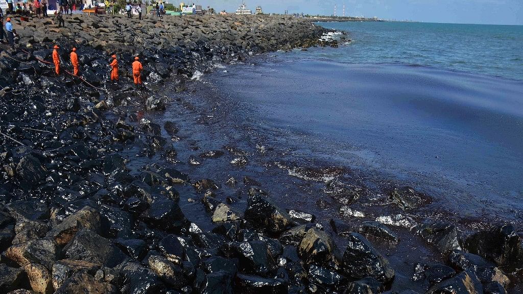 The crew of two ship which caused a massive oil spill in Chennai by colliding off the city’s coast are being interrogated to determine responsibility. (Photo: AP)