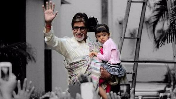 Big B poses with granddaughter Aaradhya outside his home.&nbsp;