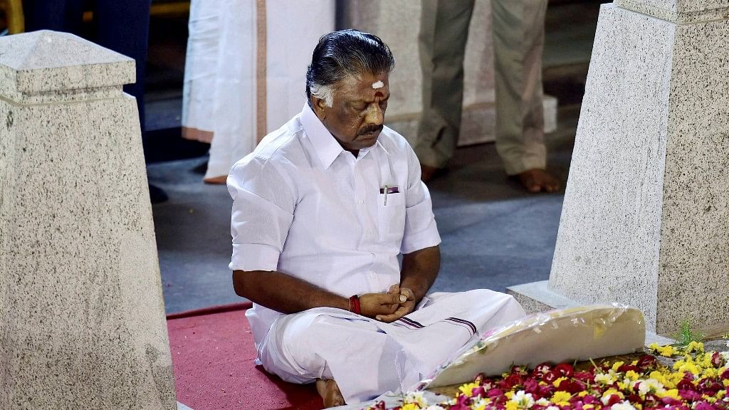 Chennai: Tamil Nadu Chief Minister O Panneerselvam sitting in a meditation in front of late J Jayalalithaas burial site at the Marina Beach in Chennai on Tuesday. (Photo: PTI)