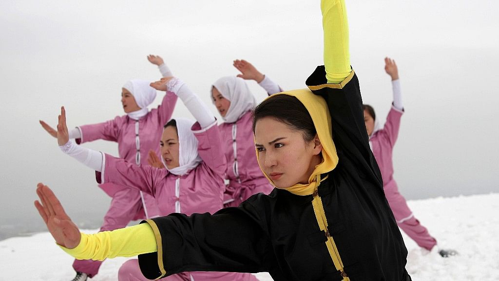 Shaolin martial arts students follow their trainer, Sima Azimi,  during a practice session on a hilltop in Kabul, Afghanistan. (Photo: AP)