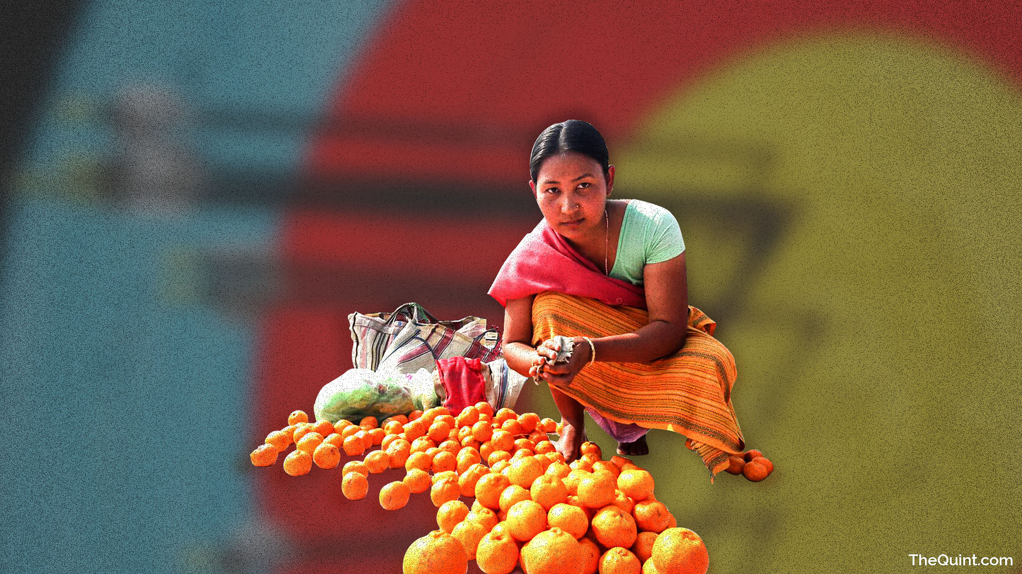 Buli Basumatary, once a national level archer now sells oranges on the roadside (Photo: <b>The Quint</b>)