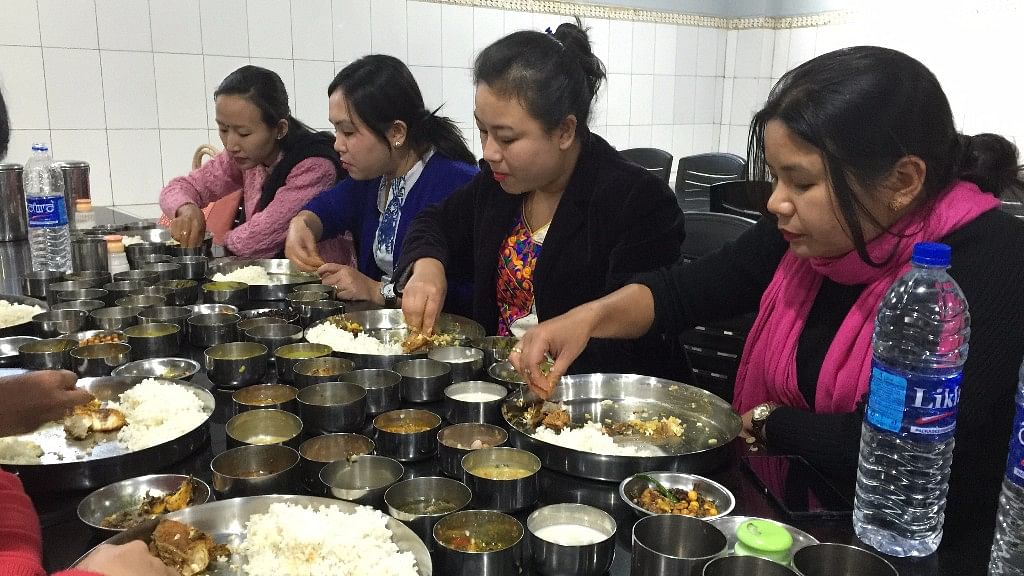 Some women feasting at Manipur’s Luxmi kitchen. (Photo: <b>The Quint</b>/Tridip Mandal)