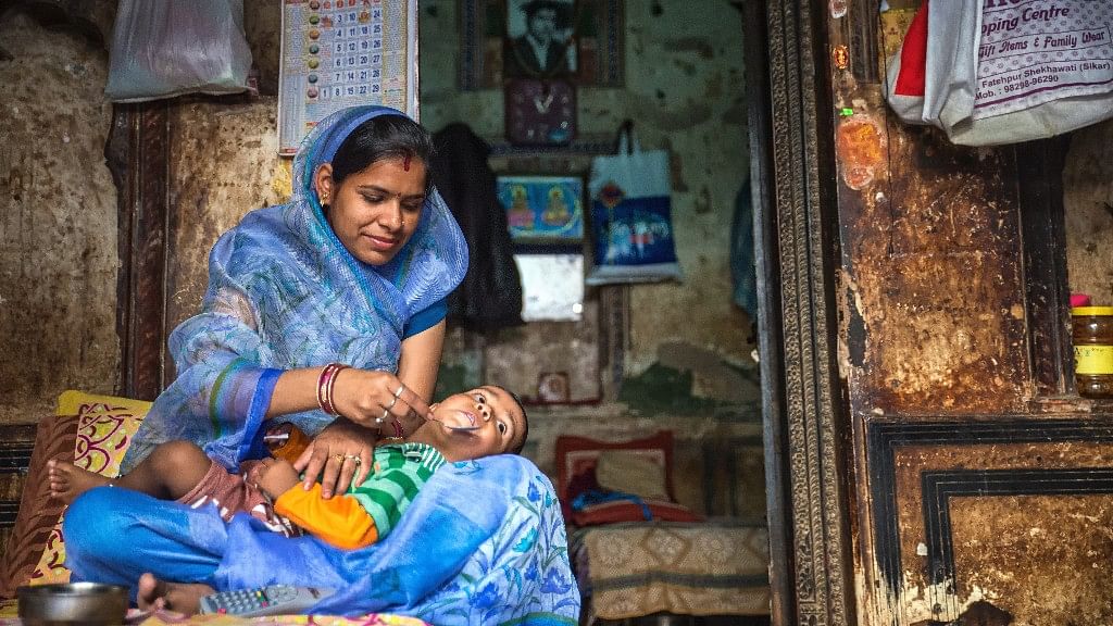 An Indian mother feeding her child (Image: iStock)