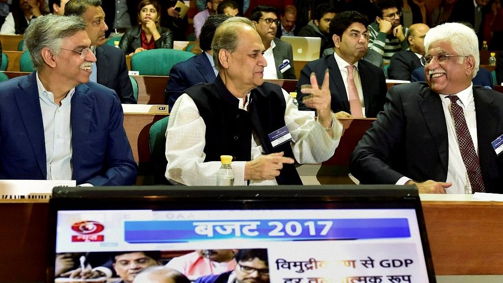 Industrialists Rahul Bajaj (centre), SK Munjal (right) and Rakesh Bharti Mittal (left) watch the live screening of the Union Budget in New Delhi on Wednesday. (Photo: PTI)